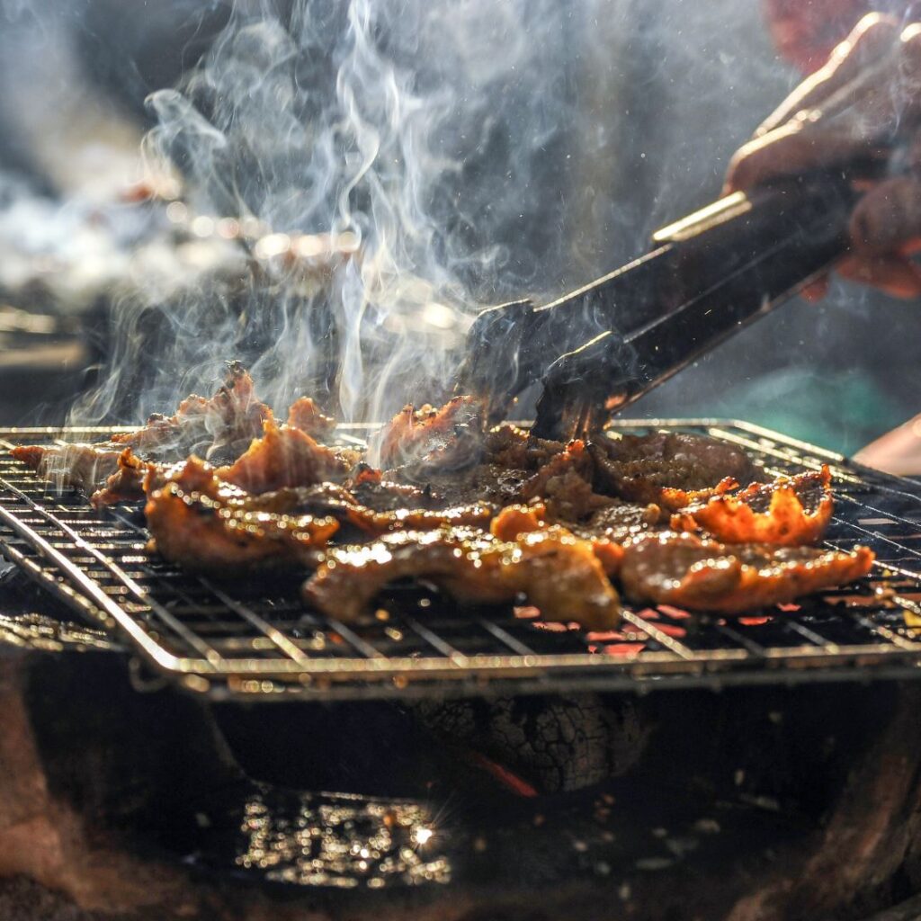 Barbequed meat on a grill